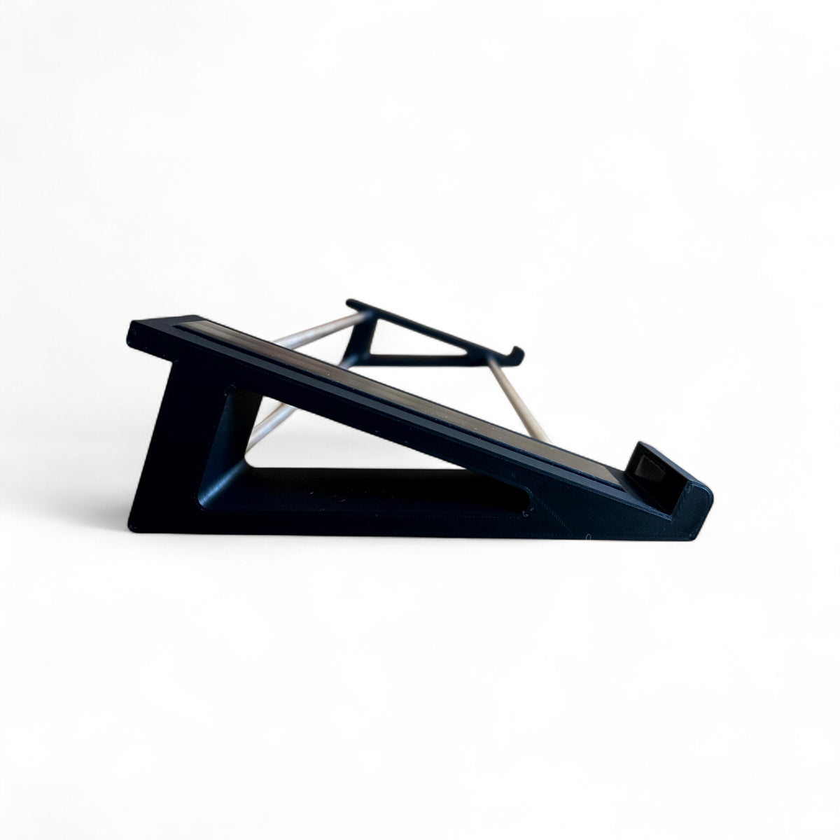 3D printed Arturia Keystep Midi Keyboard 20 degree stand by Cold Earth Industries, shown side view in black on a white background