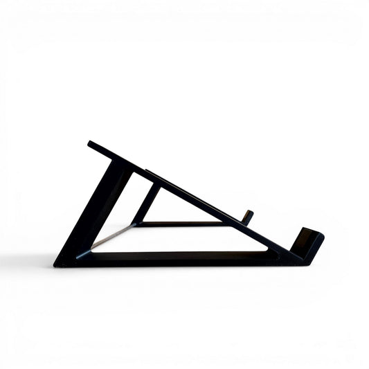 3D printed Akai MPC Live II Standalone Music Production Center 30 degree desktop stand by Cold Earth Industries, shown side view, in black, on a white background