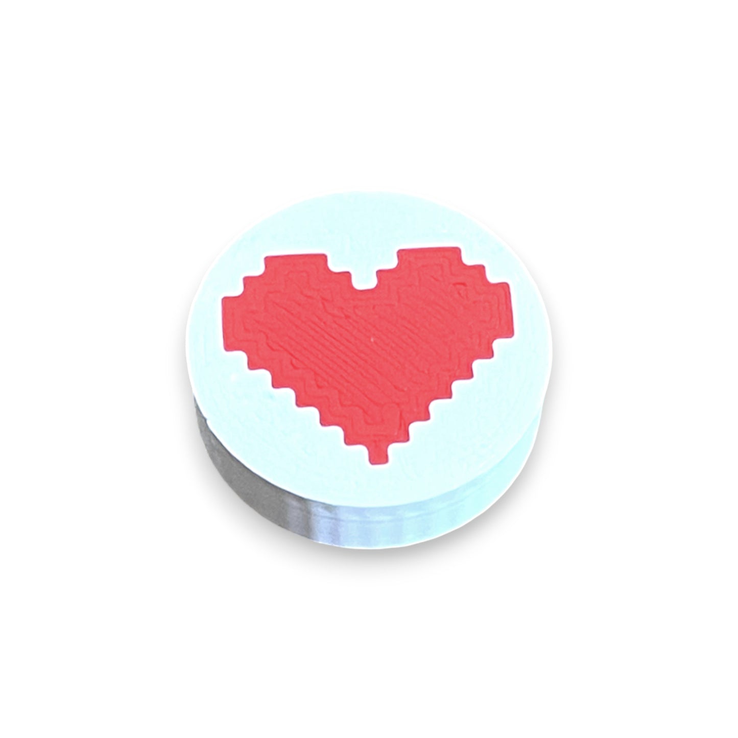 Heart Low Profile Guitar Pedal Footswitch Toppers for 8.5mm / 10mm / 11mm Foot Switches. 3D printed by Cold Earth Industries, shown on a white topper with a red heart on top, against a white background.