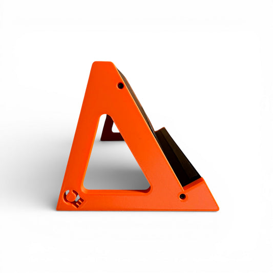 3D printed Guitar Pedal Desktop Stand - Open Sides 400mm x 150mm 60 Degree Pedalboard & Synth Stand stand by Cold Earth Industries, shown side view in black with Orange Sides, on a white background – custom desktop stands.