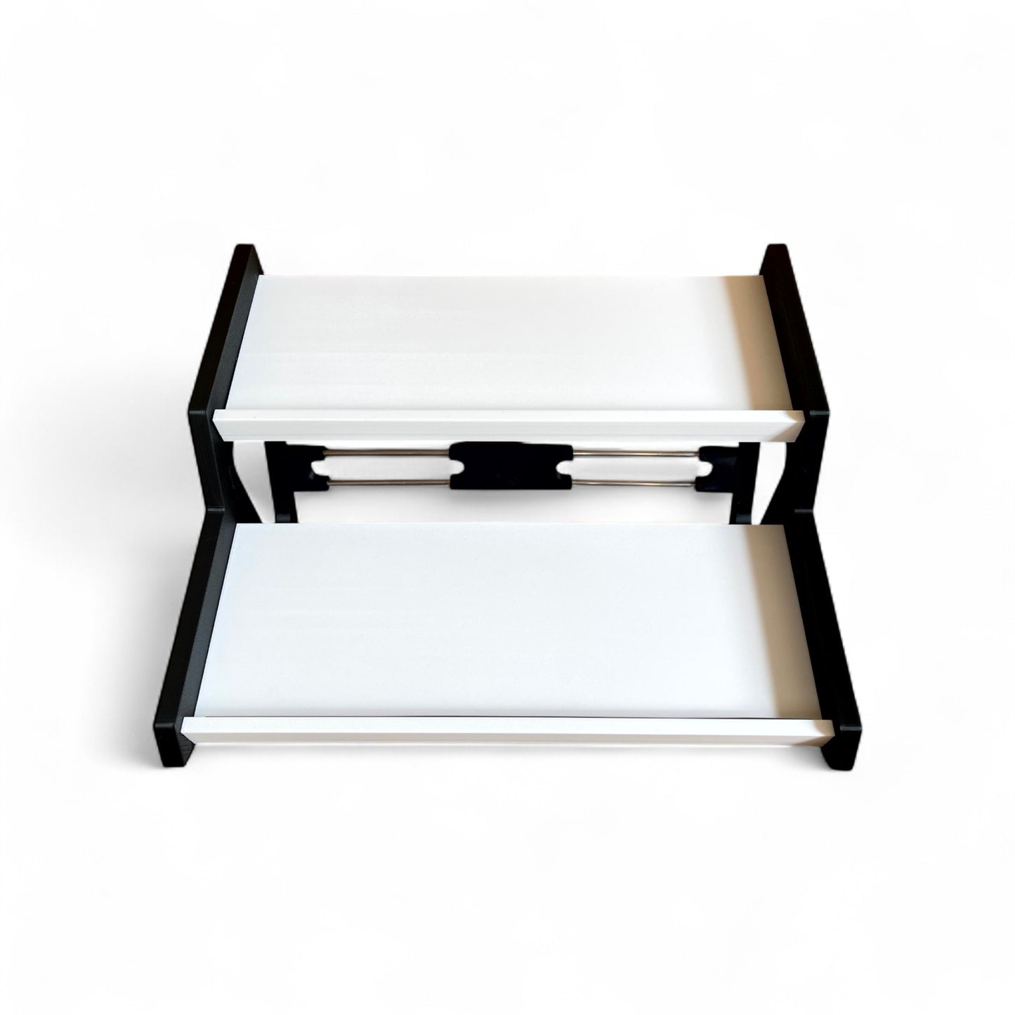 3D printed Guitar Pedal Desktop Stand 2 Tier 400mm width x 150mm hold depth per tier, 30 Degree Pedalboard & Synth Stand stand by Cold Earth Industries, shown front view in white with black sides on a white background shown holding guitar pedals – custom desktop stands.