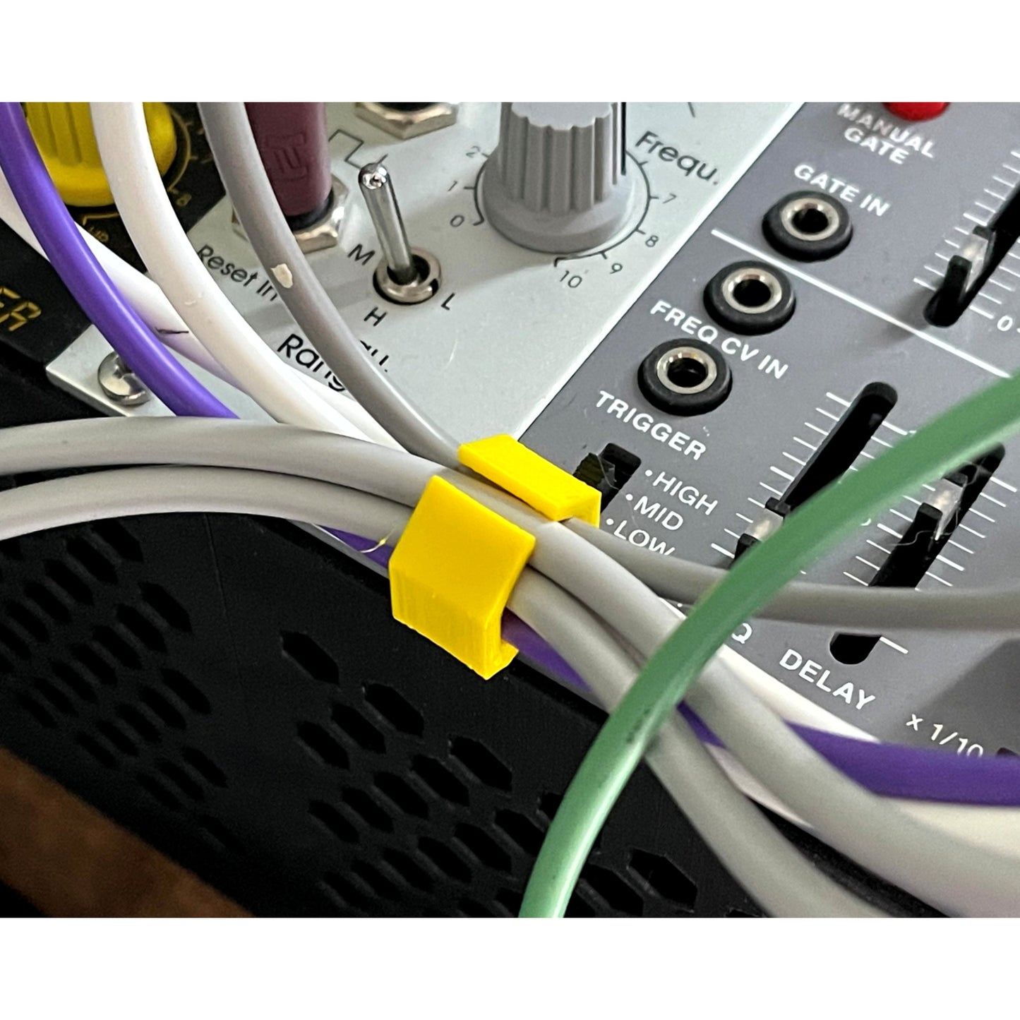Cold Earth Industries Eurorack Patch Cable Clips (Pack of 10) | 3D Printed Eurorack Cable Clip | Cold Earth Industries - Custom 3D printed cable clips - Studio Shot - by Cold Earth Industries