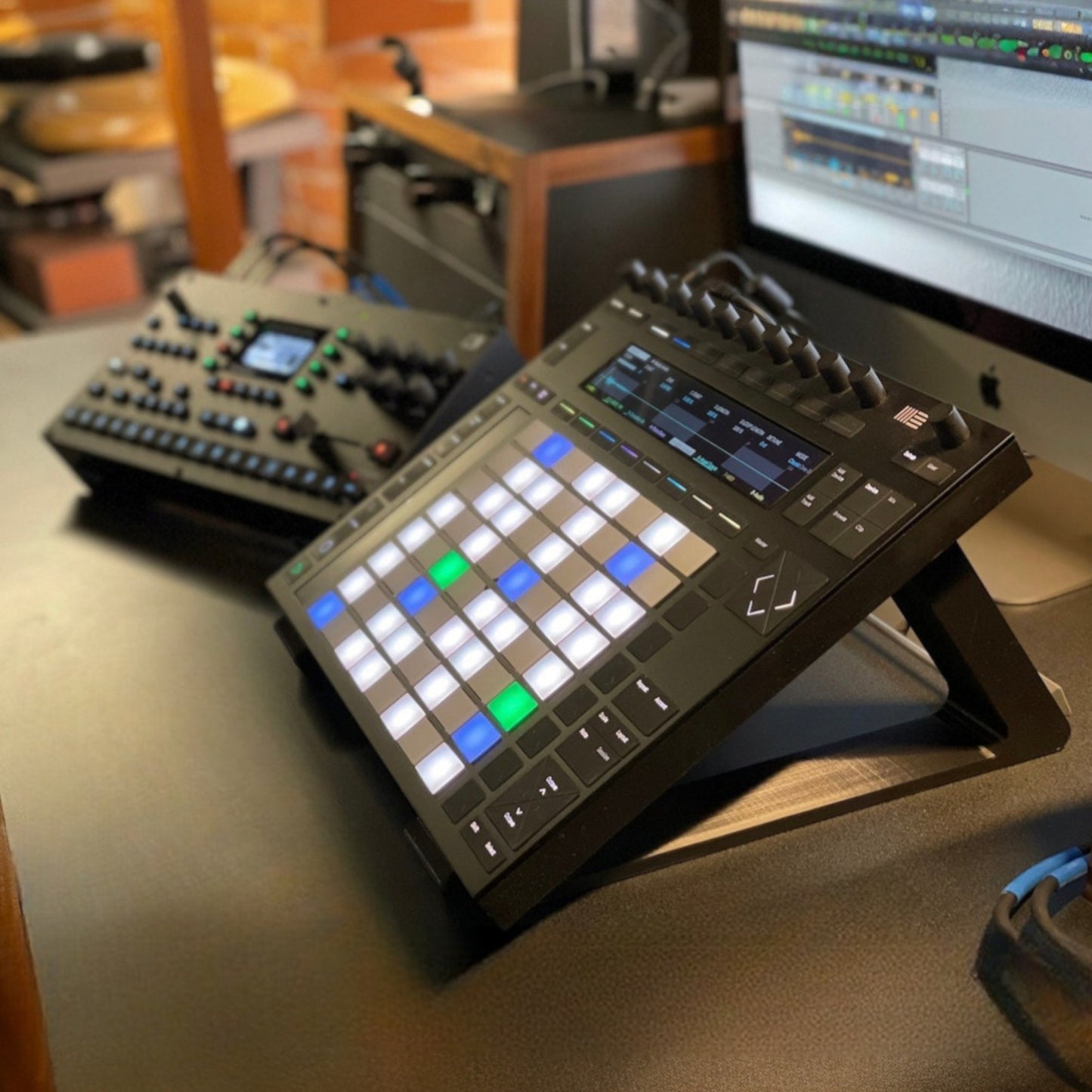 3D printed Ableton Push 2 Midi Controller 30 Degree stand by Cold Earth Industries, shown in a music studio