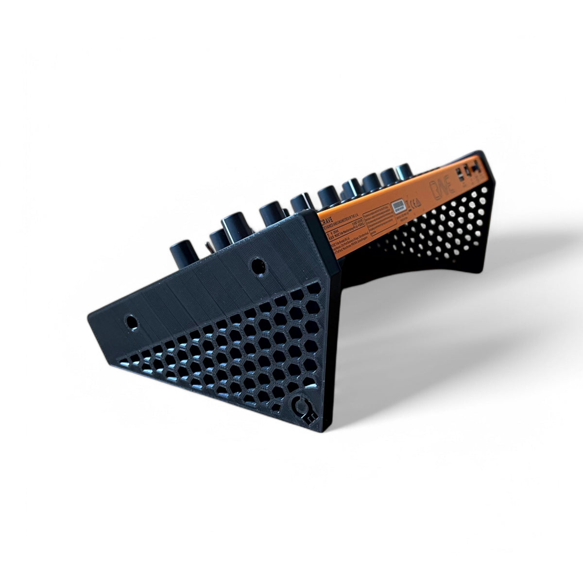 3D printed Behringer Crave / Edge / Spice / Grind Hex Side Panels Synth stand by Cold Earth Industries, shown with Behringer Crave in black on a white background β custom desktop stands.