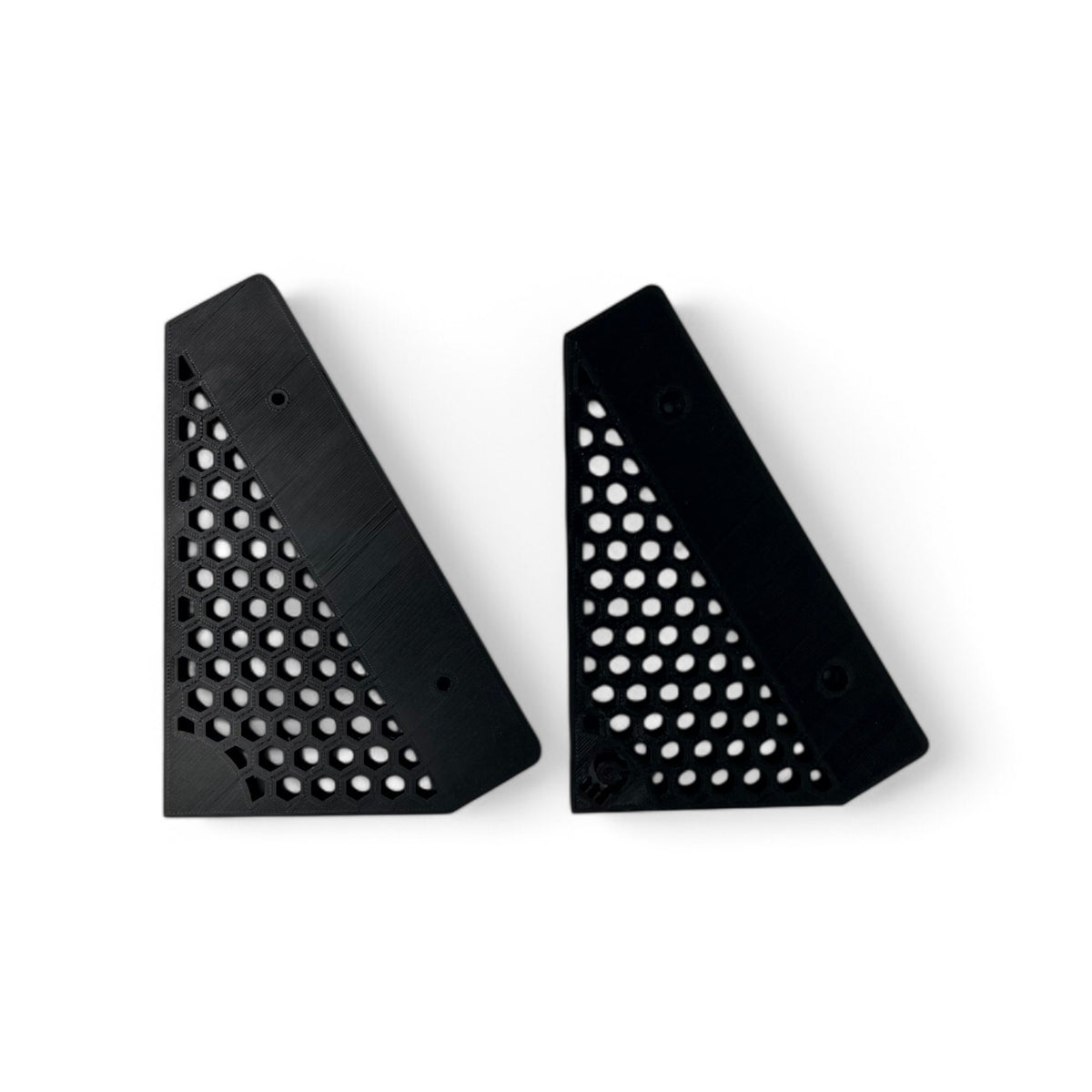 3D printed Behringer Crave / Edge / Spice / Grind Hex Side Panels Synth stand by Cold Earth Industries, shown side panels only in black on a white background β custom desktop stands.