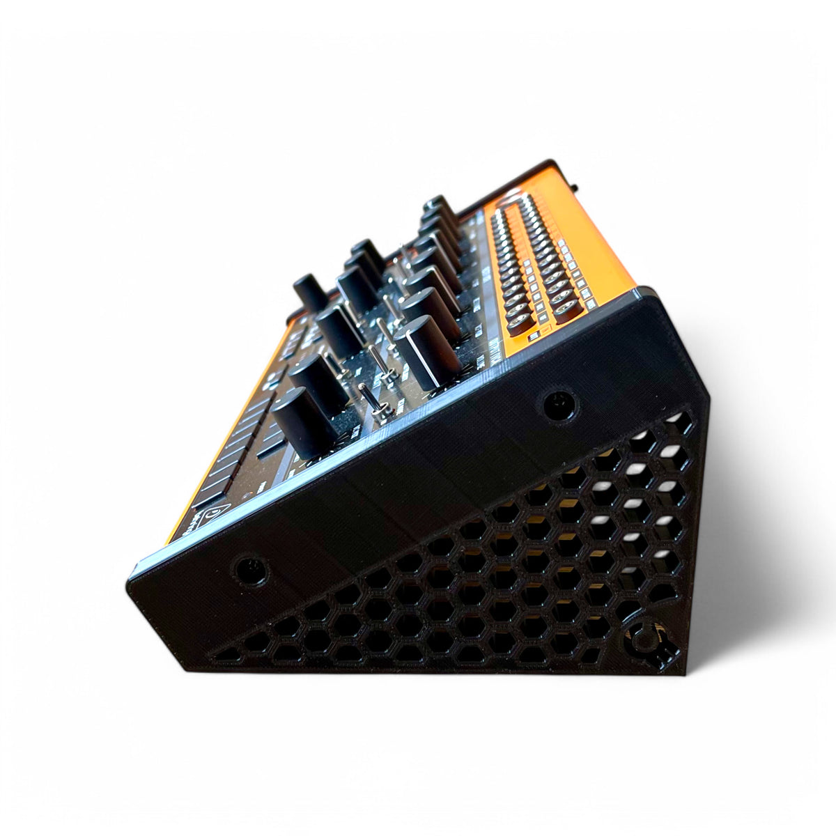 3D printed Behringer Crave / Edge / Spice / Grind Hex Side Panels Synth stand by Cold Earth Industries, shown side view with Behringer Crave in black on a white background β custom desktop stands.