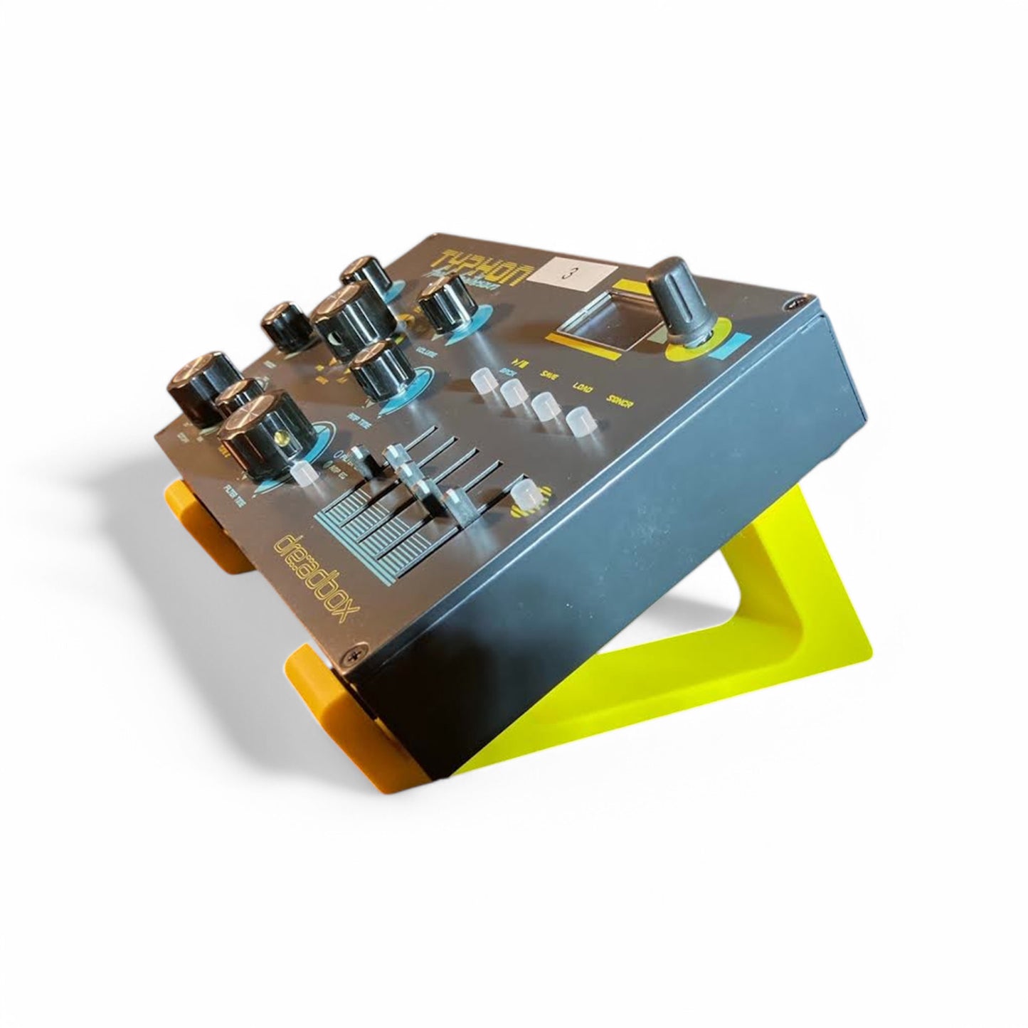 3D printed Dreadbox Typhon Synth 30 degree stand by Cold Earth Industries, shown side view in yellow on a white background holding a Dreadbox Typhon Synthesizer