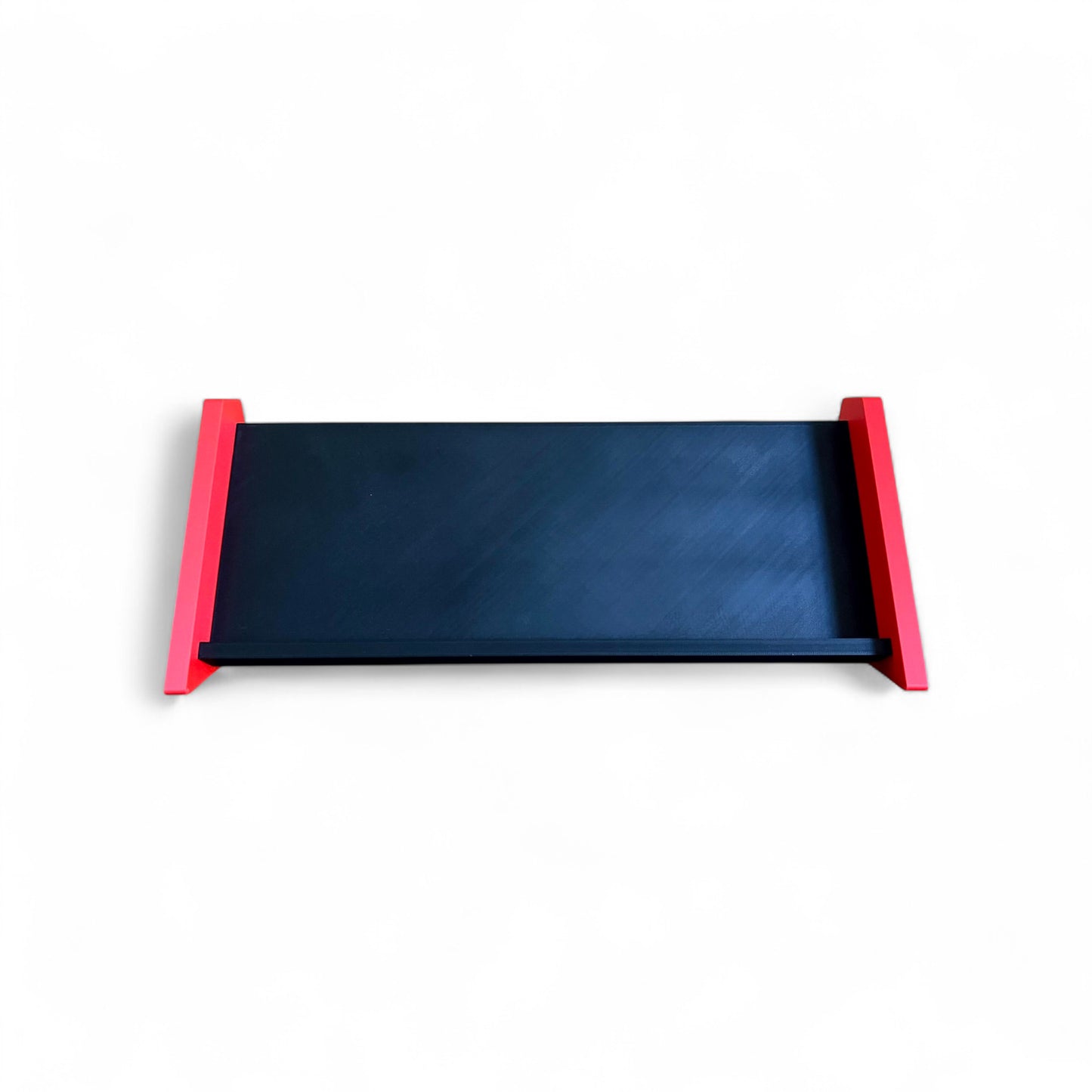 3D printed Desktop Pedalboard 400mm x 150mm 30 Degree Guitar Pedal & Synth Stand stand by Cold Earth Industries, shown from in front, in black with red sides, on a white background – custom desktop stands.