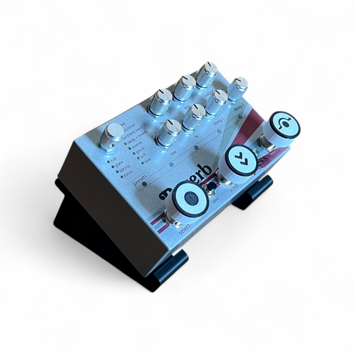 3D printed Empress Reverb / Echosystem Guitar Pedal 30 Degree stand by Cold Earth Industries, shown in black on a white background holding an Empress Reverb Guitar Pedal – custom desktop stands.