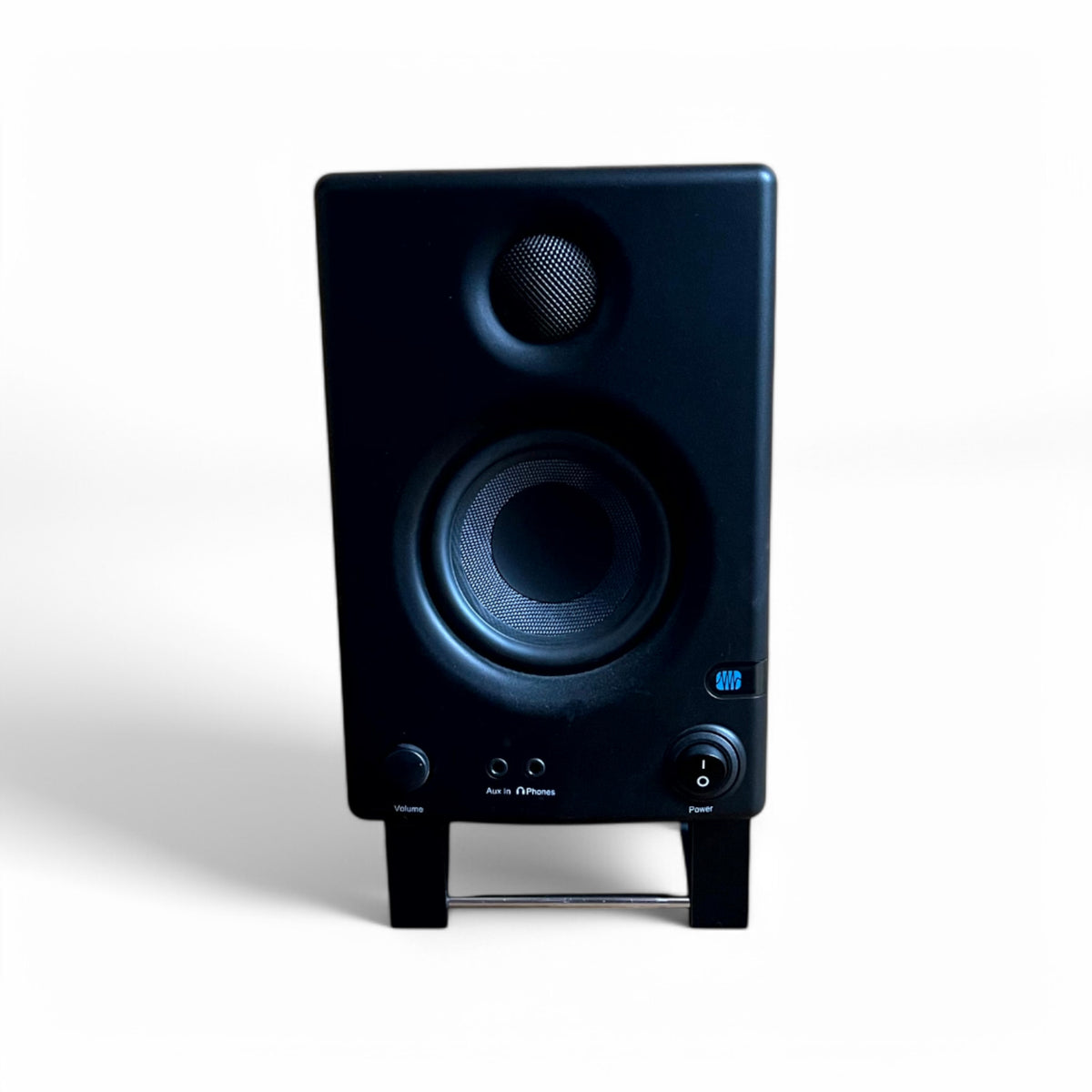 A pair of 3D printed Presonus Eris E4.5 Studio Speaker / Monitor 0 - 24 degree stands holding a pair of Presonus Eris 4.5 speakers, by Cold Earth Industries. Shown front view in white on a white background