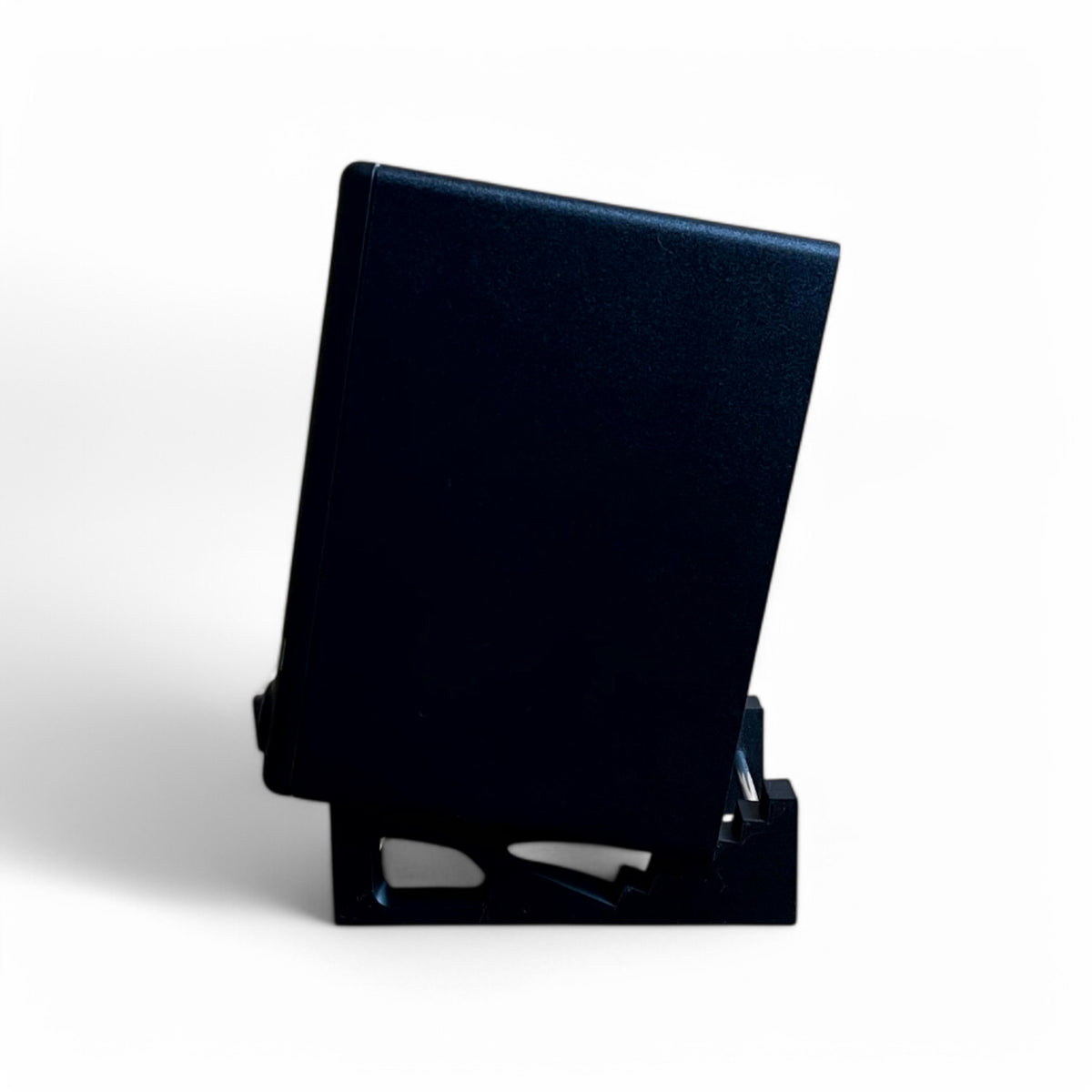 3D printed Presonus Eris E3.5 Studio Monitors Speaker / Monitor 24 degree stand by Cold Earth Industries, shown side view holding a Presonus Eris 3.5 speaker, in black, on a white background