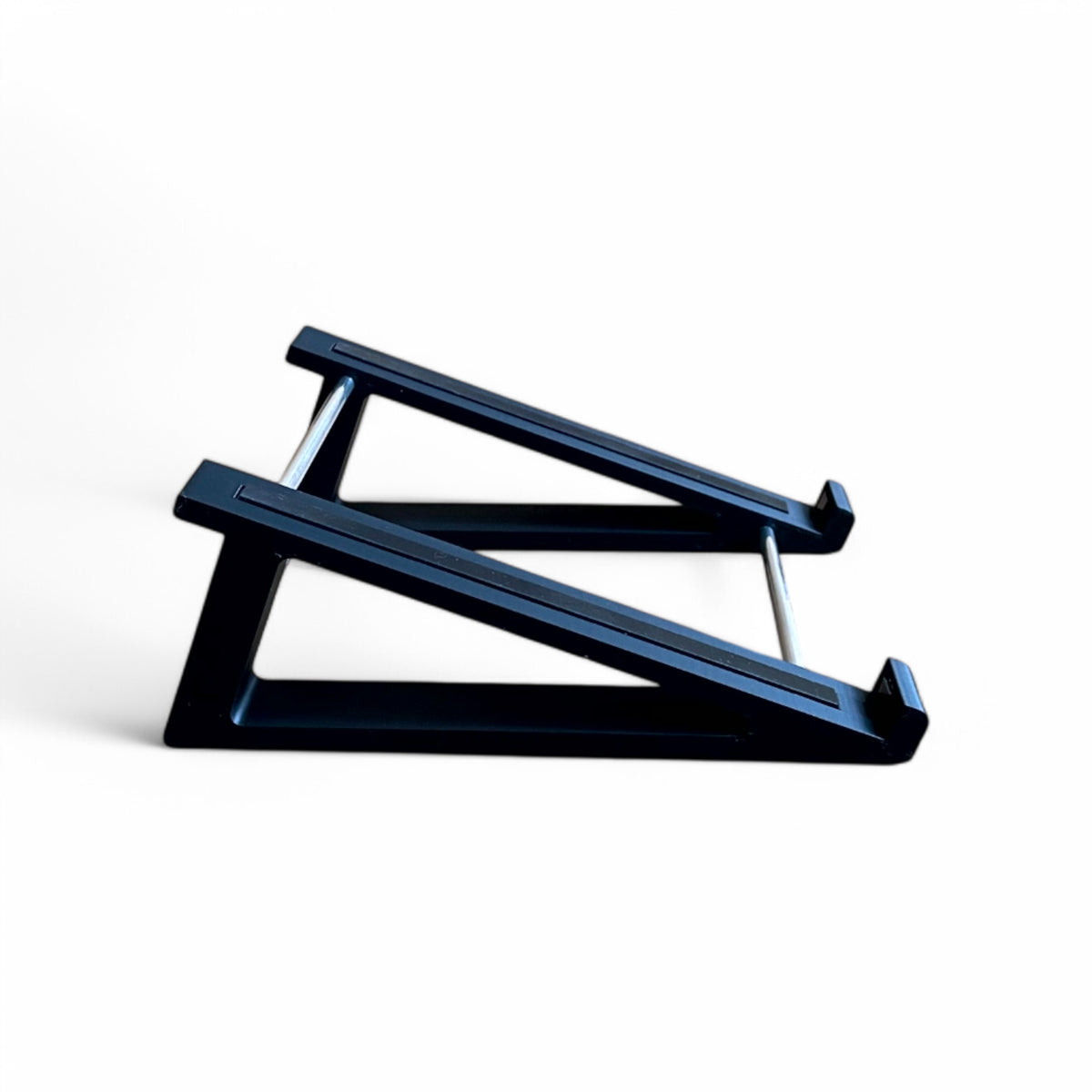 3D printed Presonus Atom Midi Controller 20 degree stand with rubber strips by Cold Earth Industries, shown side view in black on a white background
