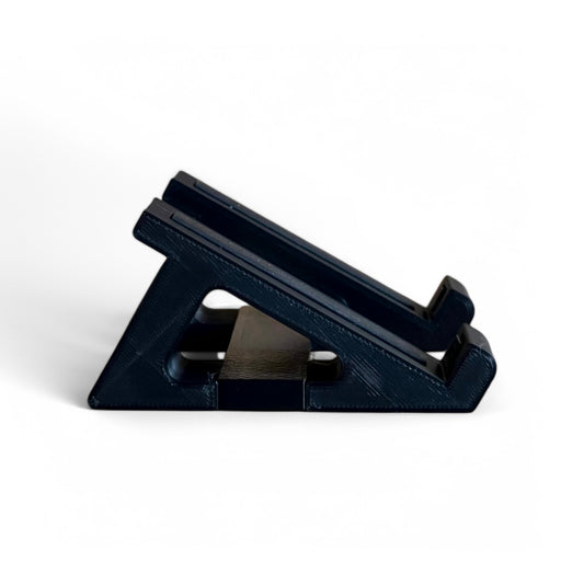 3D printed Korg Nu:Tekt NTS-2 Oscilloscope FX 30 degree stand by Cold Earth Industries, shown side view in black on a white background