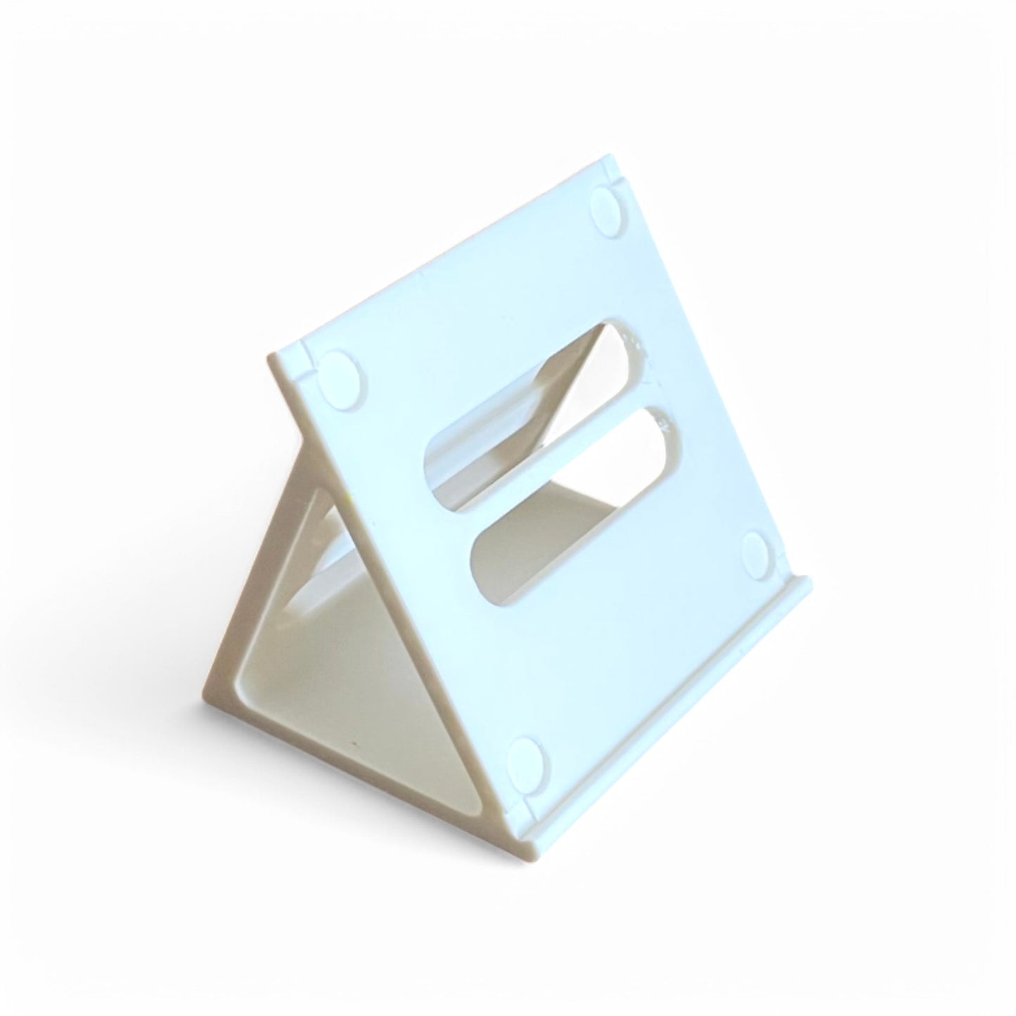 A white Korg NTS-3 KAOSS Pad stand made by Cold Earth Industries, featuring cutout holes for feet and screws, and rubber feet.