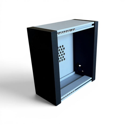 3D printed 20HP 3U Eurorack modular synthesizer case by Cold Earth Industries, shown, front angle view stood up, with grey body and black side panels on a white background – custom desktop skiff enclosure.