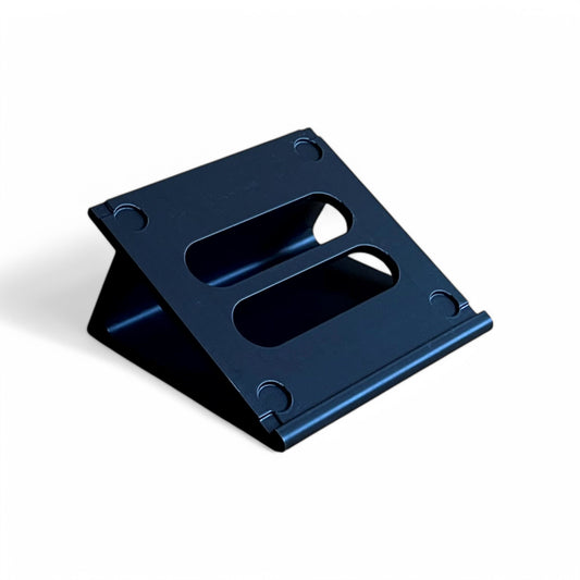 A black Korg NTS-3 KAOSS Pad stand made by Cold Earth Industries, featuring cutout holes for feet and screws, and rubber feet.