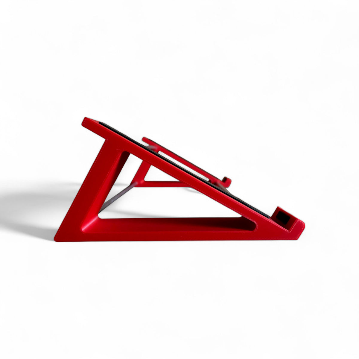 3D printed Korg Minilogue XD Module Synth 30 degree stand by Cold Earth Industries, shown side view in red on a white background