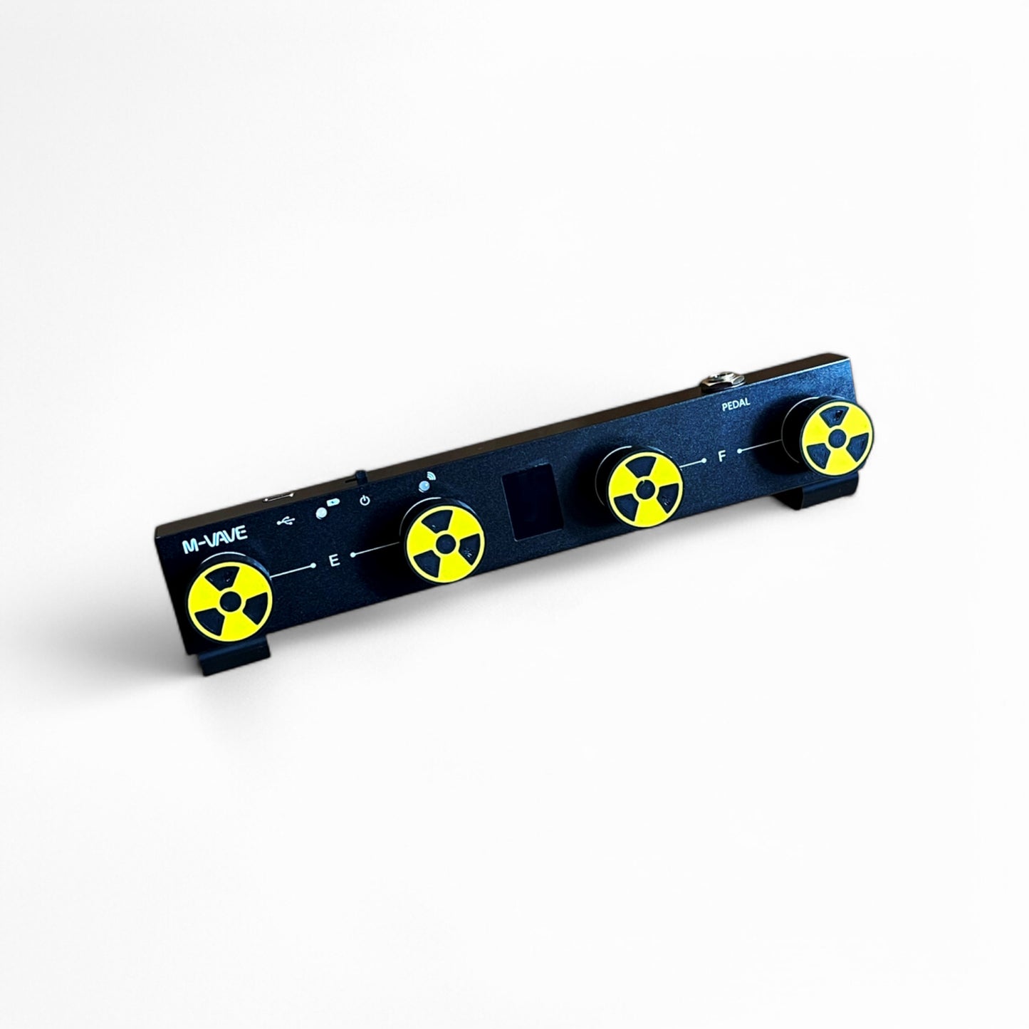 3D printed Radiation Sign Guitar Pedal Footswitch Toppers 4 Pack on a guitar pedal by Cold Earth Industries, shown with a black and yellow Radiation Sign on a white background – custom