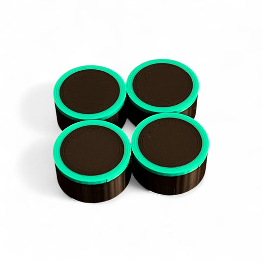 Set of 4 Guitar Pedal Footswitch Topper for 11MM Foot Switch. 3D printed Black Base and Green Ring Design by Cold Earth Industries, shown on a white background.
