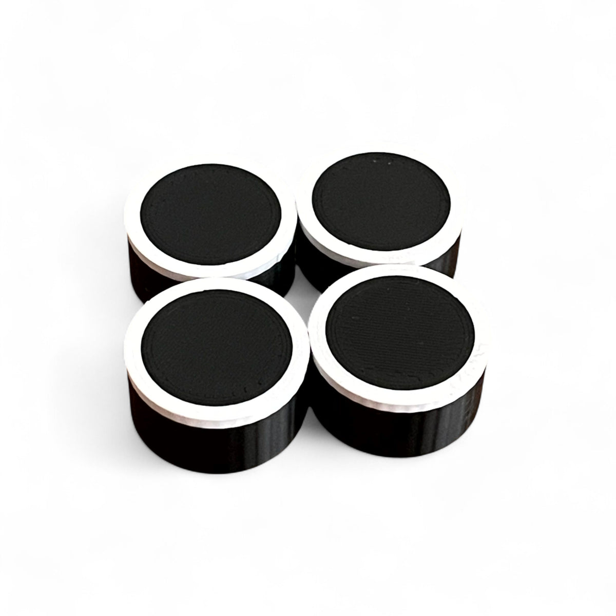 Set of 4 Guitar Pedal Footswitch Topper for 11MM Foot Switch. 3D printed Black Base and White Ring Design by Cold Earth Industries, shown on a white background.