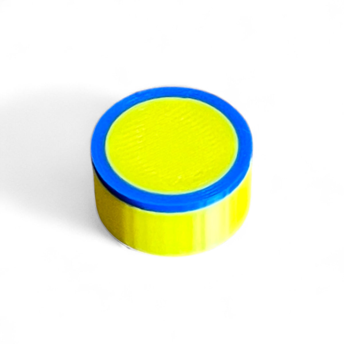 Guitar Pedal Footswitch Topper for 11MM Foot Switch. 3D printed Yellow Base and Blue Ring Design by Cold Earth Industries, shown on a white background.