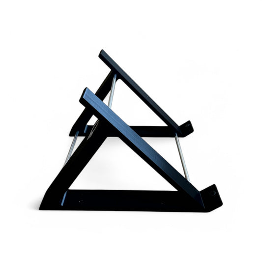 Side view of a black desktop stand from Cold Earth Industries designed for the Roland SH-4d Digital Desktop Synthesizer, featuring a robust PLA+ & aluminum structure at a 45 degree angle.