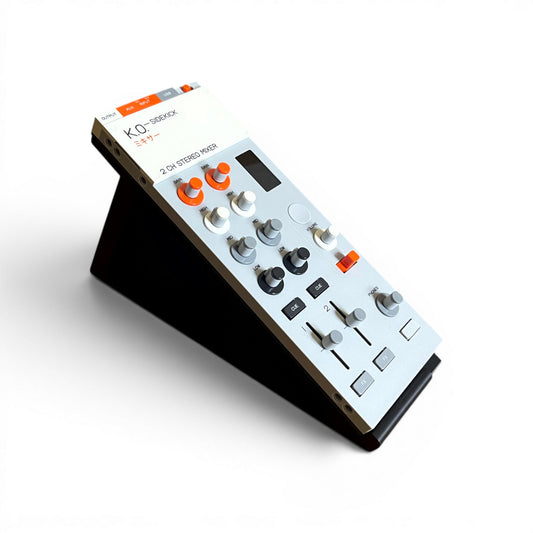 3D printed Teenage Engineering KO-Sidekick Mixer + Audio Interface Mixer 30 Degree stand by Cold Earth Industries, shown with Sidekick Mixer, in black, on a white background – custom desktop stands.