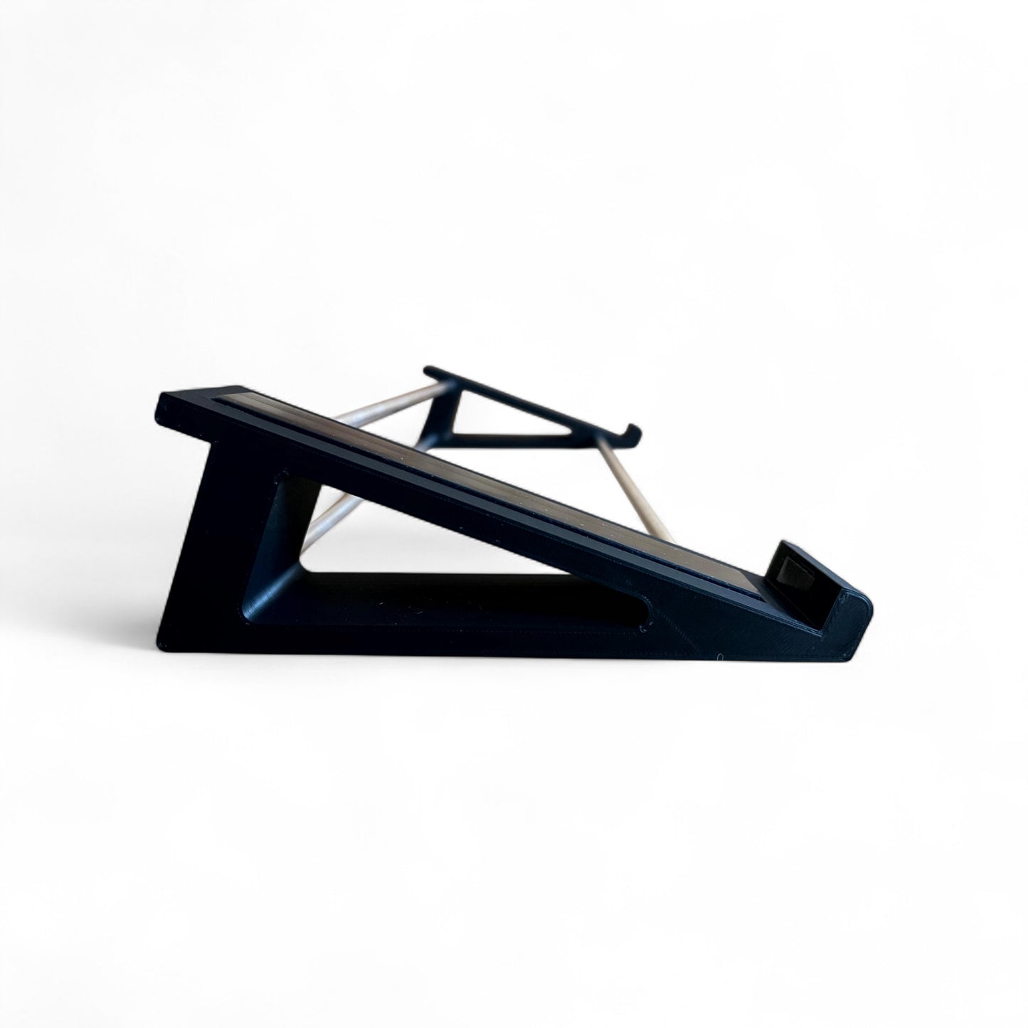 3D printed Arturia Keystep Midi Keyboard 20 degree stand by Cold Earth Industries, shown side view in black on a white background