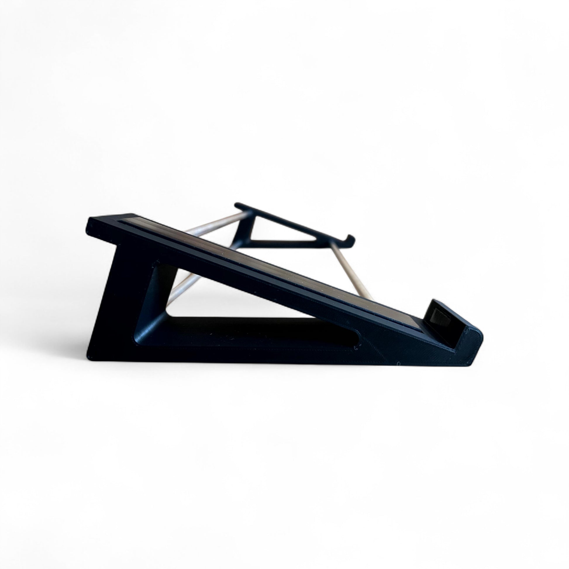 3D printed Arturia Keystep Midi Keyboard 20 degree stand by Cold Earth Industries, shown side view in black on a white background