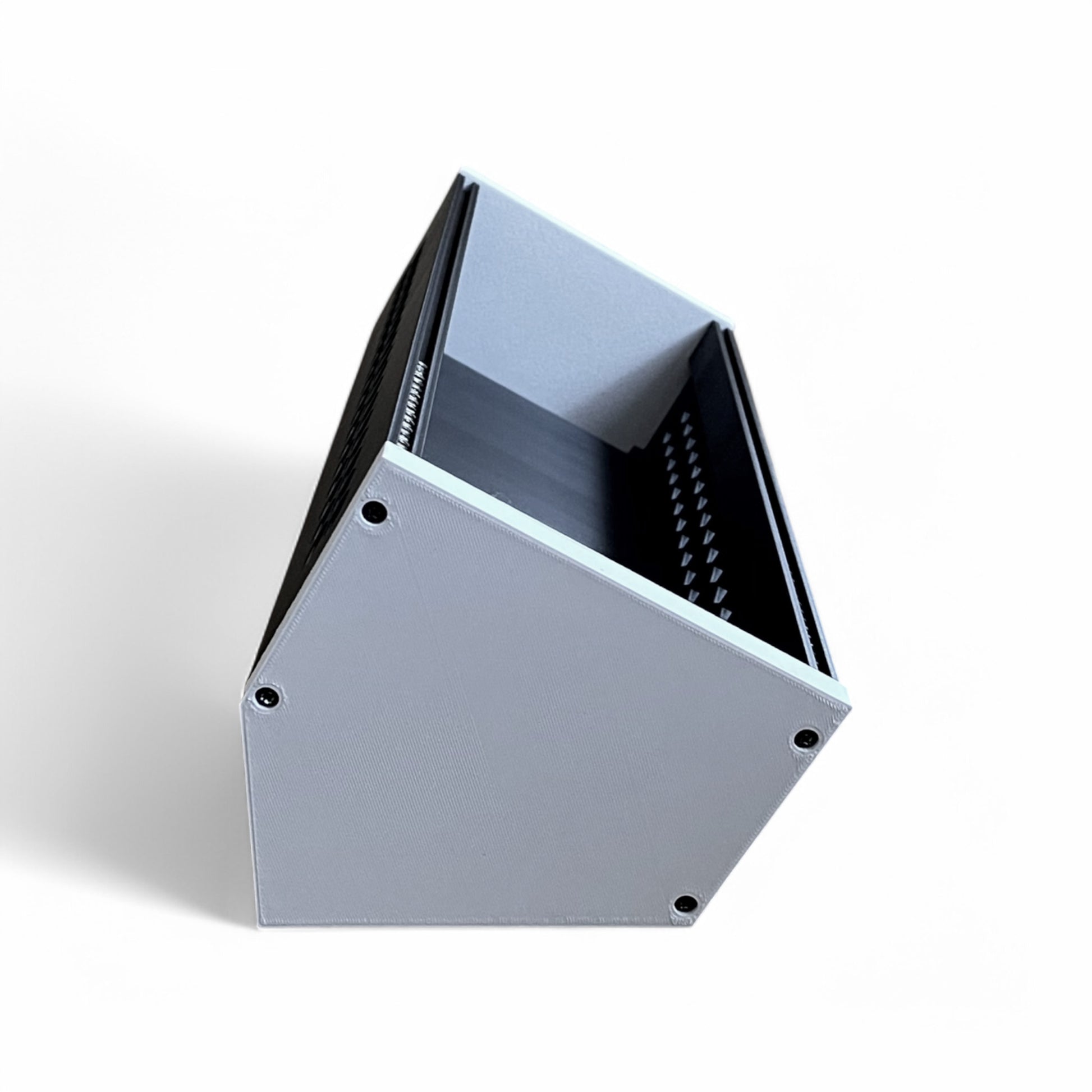 3D printed 62HP 3U Eurorack modular synthesizer case by Cold Earth Industries, shown reverse side view with black body and white side panels on a white background – custom desktop skiff enclosure.
