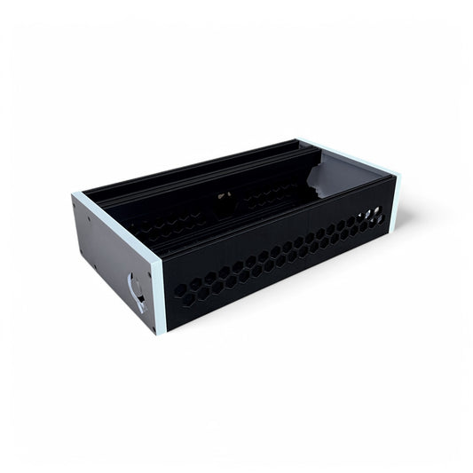 3D printed 62HP 4U Eurorack modular synthesizer case by Cold Earth Industries, shown with black body and white side panels on a white background – custom desktop skiff enclosure.