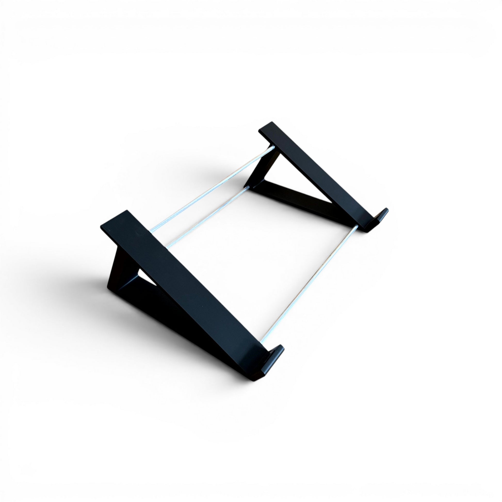 3D printed Akai MPC Live II Standalone Music Production Center 30 degree desktop stand by Cold Earth Industries, shown in black on a white background