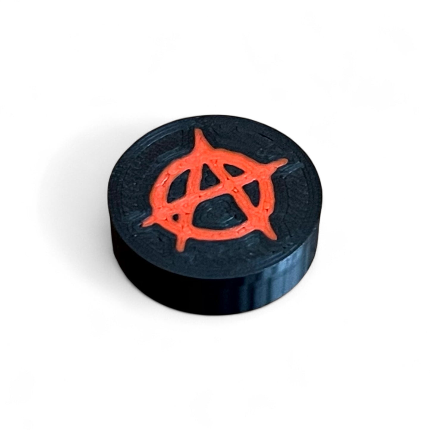 3D printed Anarchy Sign Guitar Pedal Footswitch Topper THIN Version by Cold Earth Industries, 4 shown in black with a red anarchy symbol on a white background.