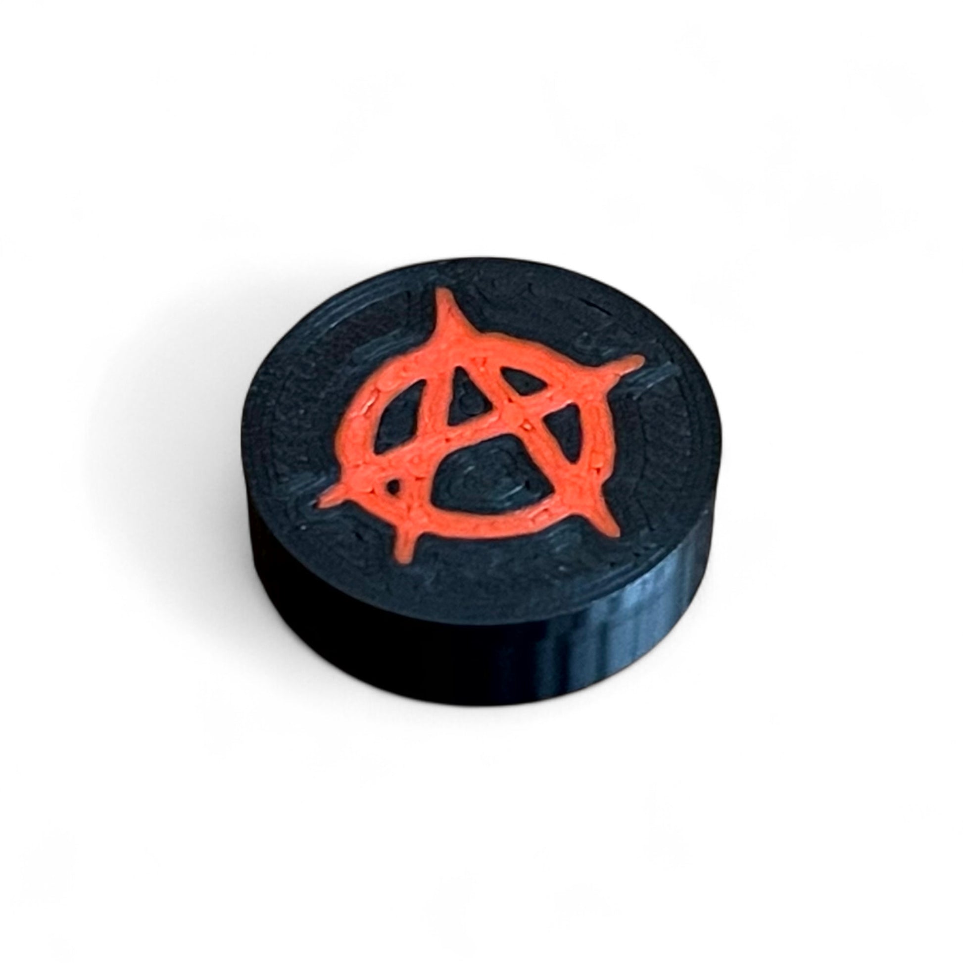 3D printed Anarchy Sign Guitar Pedal Footswitch Topper THIN Version by Cold Earth Industries, 4 shown in black with a red anarchy symbol on a white background.