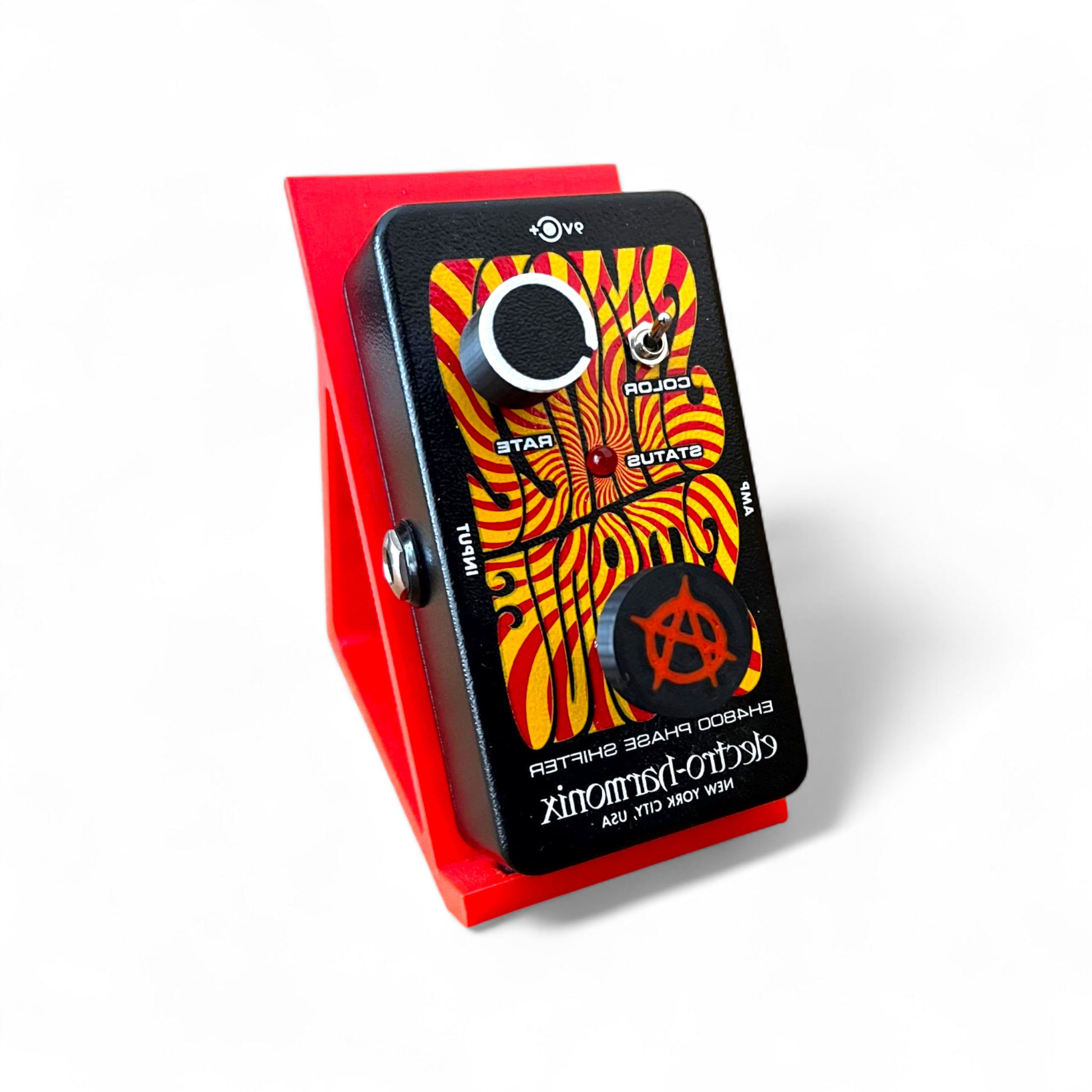 3D printed Anarchy Sign Guitar Pedal Footswitch Topper THIN Version by Cold Earth Industries, shown on a guitar pedal, black with a red anarchy symbol on a white background.