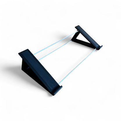 3D printed Arturia Minifreak Algorithmic Synthesizer Synth 30 degree stand by Cold Earth Industries with aluminium tubing for stability, and rubber strips and rubber feet, shown in black on a white background