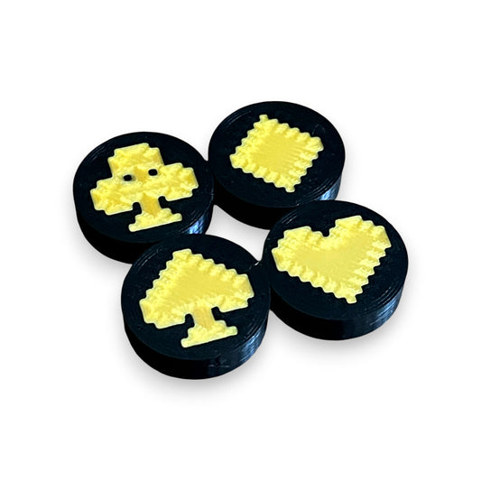 Set of 4 Low Profile Black and Gold Card Suit Guitar Pedal Footswitch Toppers for 8.5mm / 10mm / 11mm Foot Switches. 3D printed by Cold Earth Industries, shown on a white background.