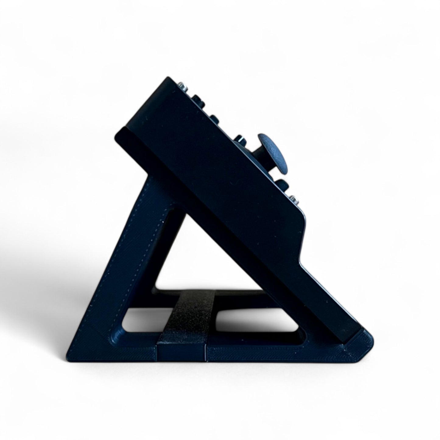 3D printed Behringer Pro VS Mini JT PHARA-O Synth 45 degree stand by Cold Earth Industries, shown side view in black on a white background with Pro VS Mini (not included) – custom desktop stands.