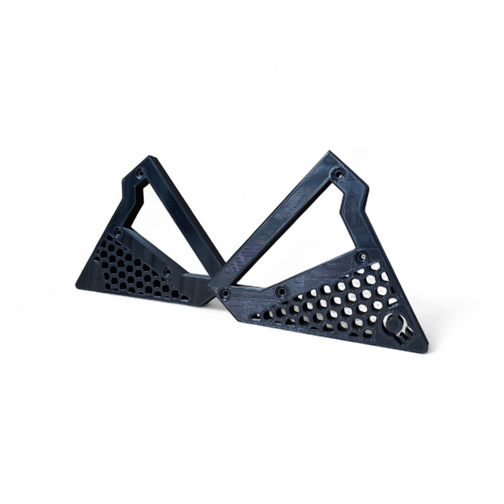 3D printed Behringer Synthesizer Hex Cut Side Panels Synth stand by Cold Earth Industries, shown in black on a white background Side Panels Only – custom desktop stands.