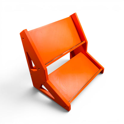 3D printed 2-Tier Guitar Pedal / Synthesizer Desktop Stand | 30 / 60 Degrees | 300mm Width stand by Cold Earth Industries, shown side view in orange, with orange side panels, on a white background – custom desktop stands.