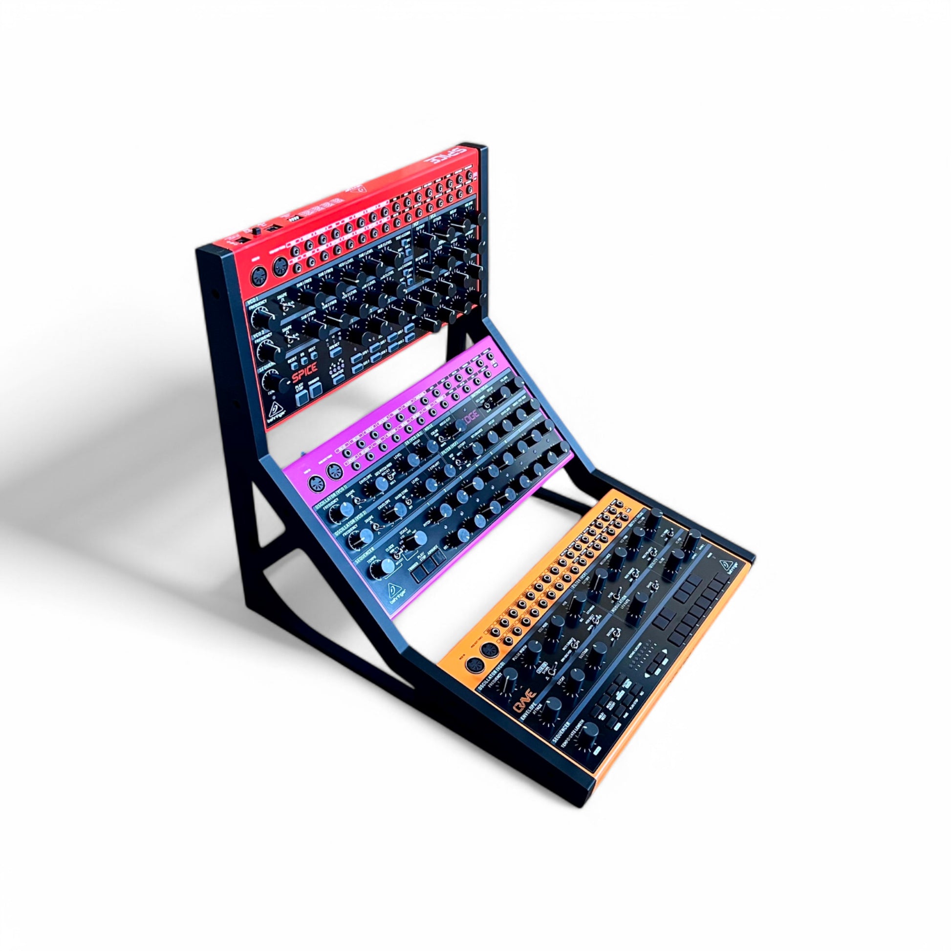 3D printed Behringer Crave / Edge / Spice / Grind 3 Tier Side Panels Synth stand by Cold Earth Industries, shown in black on a white background holding Behringer Crave, behringer Edge, Behringer Spice – custom desktop stands.