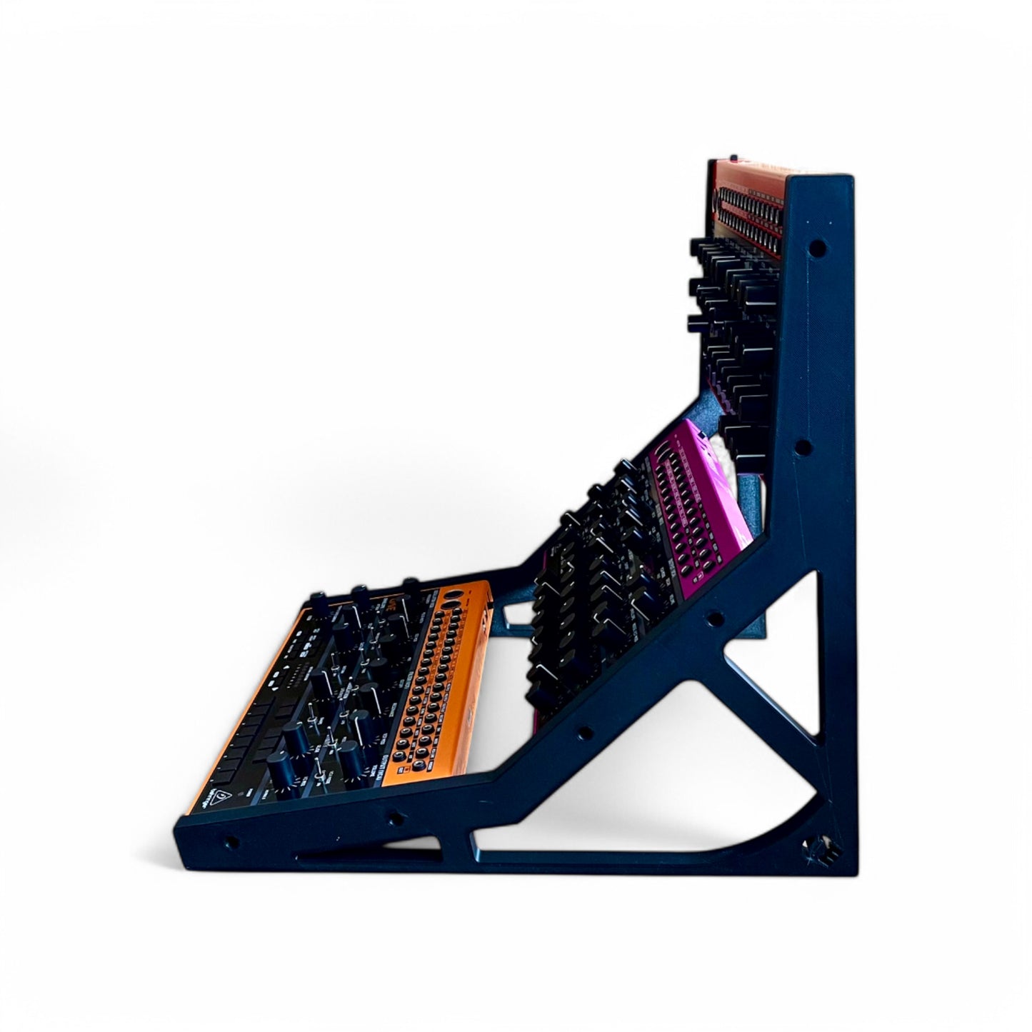 3D printed Behringer Crave / Edge / Spice / Grind 3 Tier Side Panels Synth stand by Cold Earth Industries, shown reverse  side view in black on a white background holding Behringer Crave, behringer Edge, Behringer Spice – custom desktop stands.