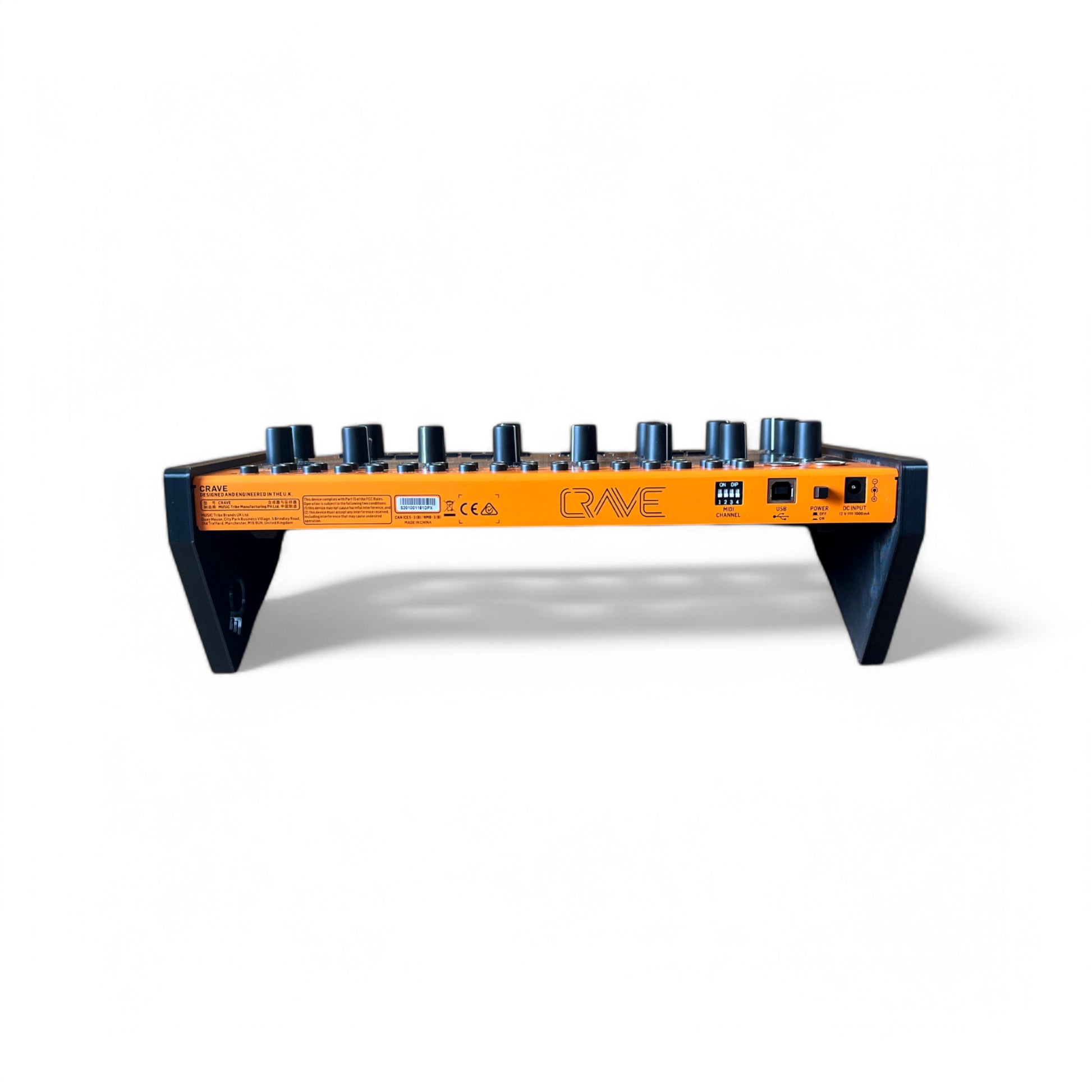 3D printed Behringer Crave / Edge / Spice / Grind Side Panels Synth stand by Cold Earth Industries, shown back view with Behringer Crave in black on a white background – custom desktop stands.