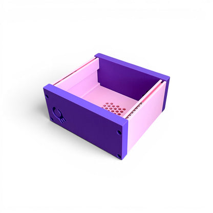 3D printed 20HP 3U Eurorack modular synthesizer case by Cold Earth Industries, shown with pink body and purple side panels on a white background – custom desktop skiff enclosure.