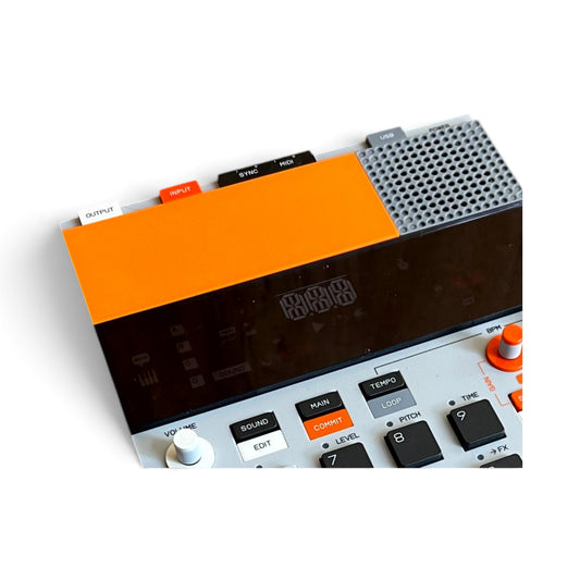 3D printed Teenage Engineering EP-133 K.O. II Sampler Battery Cover by Cold Earth Industries. Shown in orange, on a EP-133 KO II Sampler