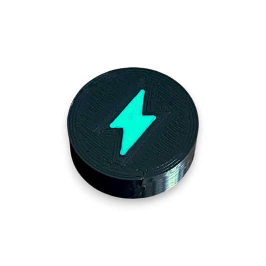 Low Profile Electric Mistress Guitar Pedal Footswitch Topper for 8.5mm / 10mm / 11mm Foot Switch. 3D printed Electric Design by Cold Earth Industries, shown in black with a green bolt icon, on a white background.
