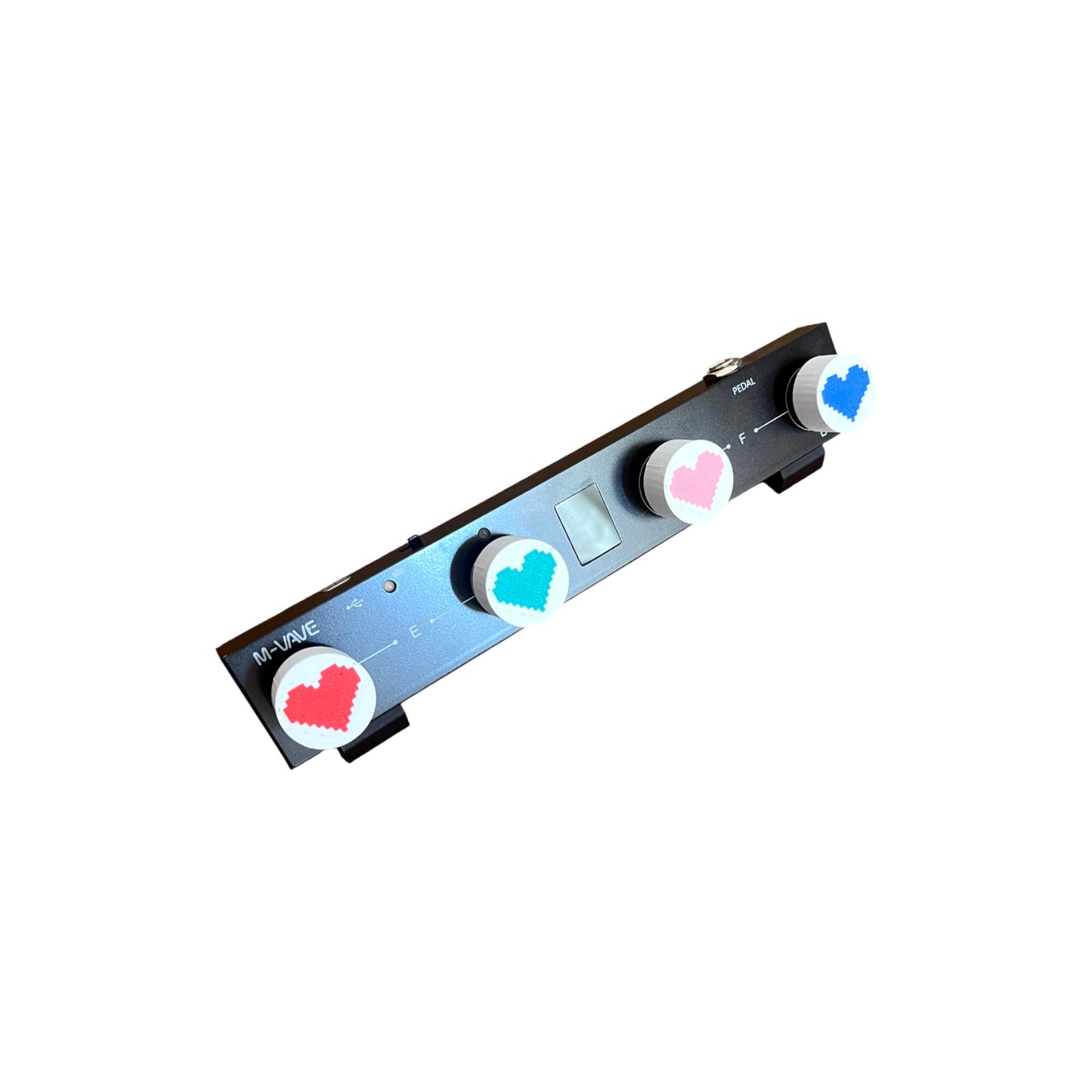 Guitar Pedal Footswitch Topper for 8.5mm / 10mm / 11mm Foot Switch. 3D printed Heart Design on White Toppers with a Green, Red, Pink and Blue heart by Cold Earth Industries, shown on a guitar pedal on a white background.