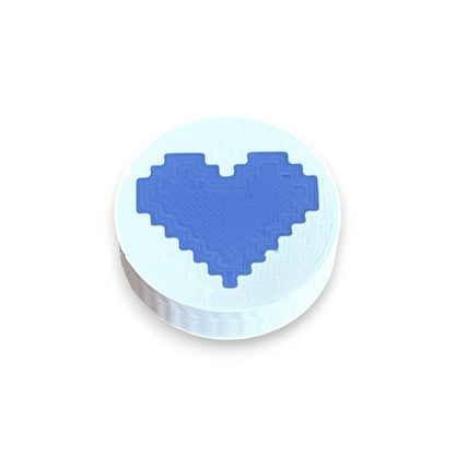 Low Profile Guitar Pedal Footswitch Topper for 8.5mm / 10mm / 11mm Foot Switch. 3D printed Heart Design on a White Topper with a Blue heart by Cold Earth Industries, shown on a white background.