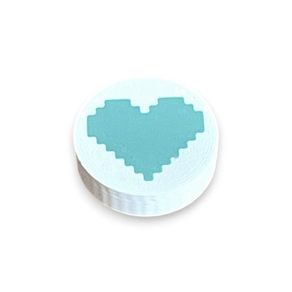 Low Profile Guitar Pedal Footswitch Topper for 8.5mm / 10mm / 11mm Foot Switch. 3D printed Heart Design on a White Topper with a Green heart by Cold Earth Industries, shown on a white background.