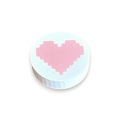 Low Profile Guitar Pedal Footswitch Topper for 8.5mm / 10mm / 11mm Foot Switch. 3D printed Heart Design on a White Topper with a Pink heart by Cold Earth Industries, shown on a white background.